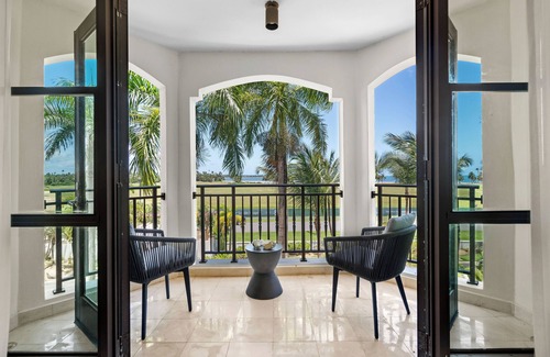 Zarzal Apartment | The Country Club Residences at Grand Reserve | Balcony with Beach & Golf Course Views | by Otium