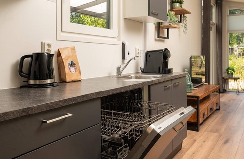 Municipality of Apeldoorn House | The Forest Lodge is a contemporary and surprisingly spacious chalet.