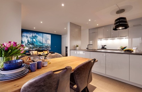 Kappeln Apartment | The Wave: luxury holiday apartment right on the water with heated lounger, sauna and fireplace