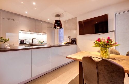 Kappeln Apartment | The Wave: luxury holiday apartment right on the water with heated lounger, sauna and fireplace