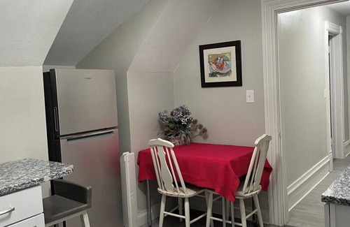 West Hill House | The Yellow-Shuttered House apt B