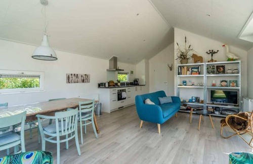 Westenschouwen House | This chalet has an extra spacious living room and two sitting areas, one of which is situated by the