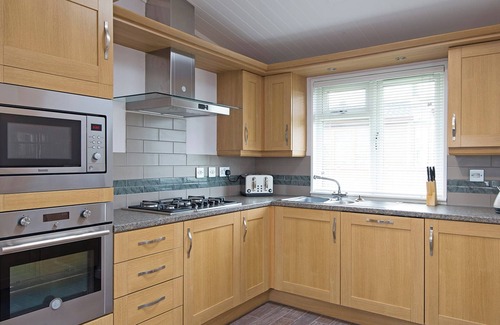 Raywell Ski Chalet | This deluxe two bedroom lodge even has its own games den.