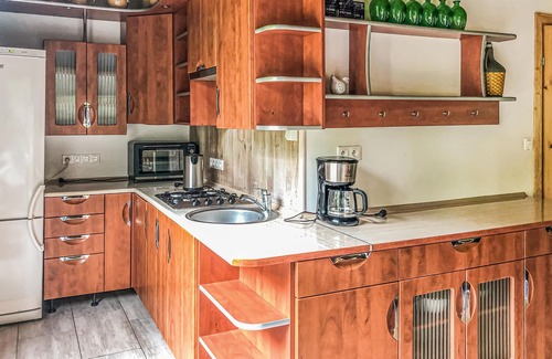 gmina Swiatki House | This holiday home is located on the edge of a village, on a large, fenced plot.