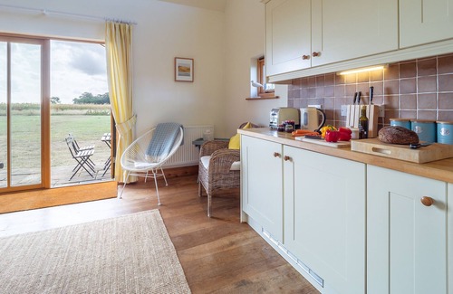 Bawdsey Apartment | This lovely holiday home on The Manor House Estate in Bawdsey provides a peaceful location for a fam