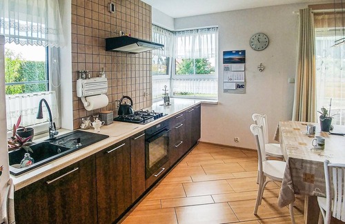Lebcz House | This modern vacation home is located in the northeast of Poland with a garden, playroom and family-f
