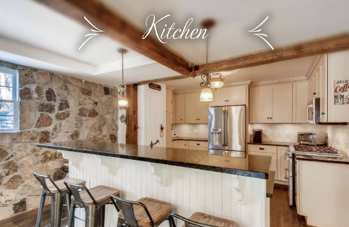 Evergreen House | Timeless 100 Year Old Creekside Cabin near Red Rocks. King size bed.