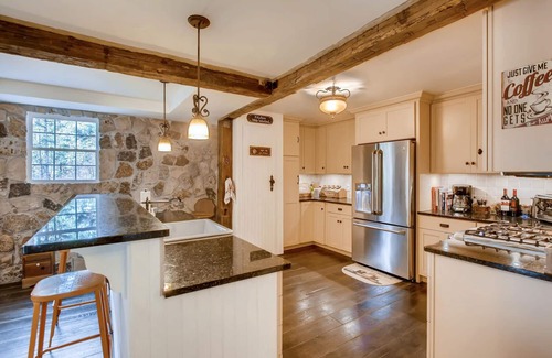 Evergreen House | Timeless 100 Year Old Creekside Cabin near Red Rocks. King size bed.