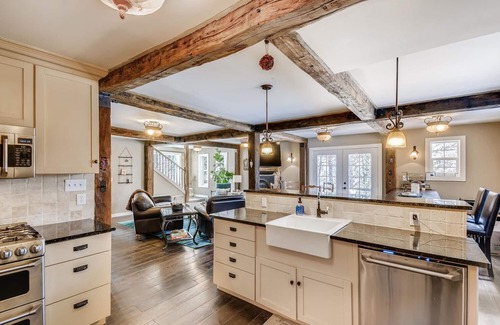 Evergreen House | Timeless 100 Year Old Creekside Cabin near Red Rocks. King size bed.