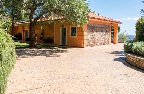 Agii Apostoli House | Traditional stone house by the sea.