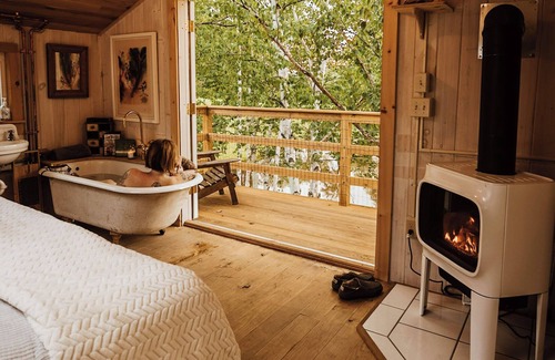 South Londonderry Cabin | Treehouse lifted up over a stocked trout pond up in the beautiful birch trees!
