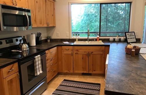 Sudden Valley House | Treetop home with partial lake view