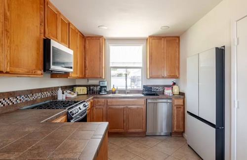 Clairemont Mesa West House | Tropical Desert Oasis w/BBQ, Hot Tub, Fire Pit, and relaxing yard ambiance.
