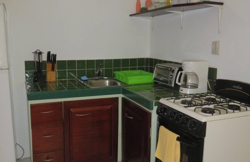 Placencia Apartment | Tropical garden experience in colorful setting in heart of Maya Beach