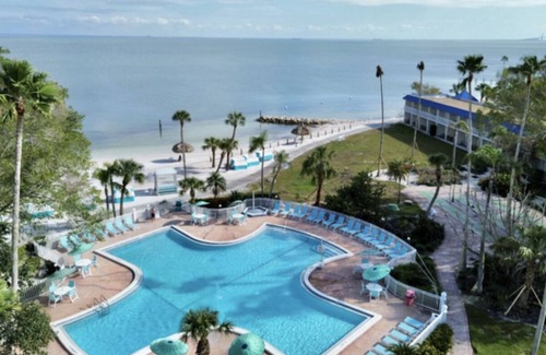 Pinellas Point House | Tropical Retreat: Outdoor Pools, Private Beach, Waterfront Dining