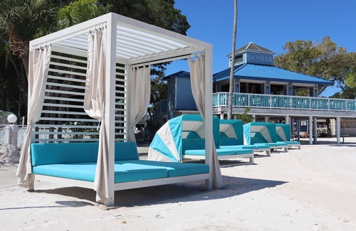 Pinellas Point House | Tropical Retreat: Outdoor Pools, Private Beach, Waterfront Dining