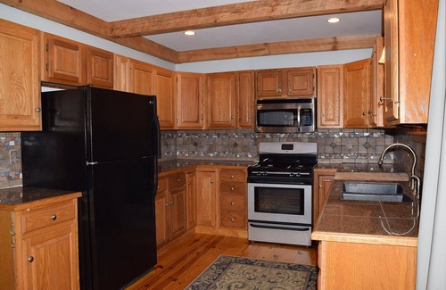 East Falmouth House | Tucked away in a private wooded setting