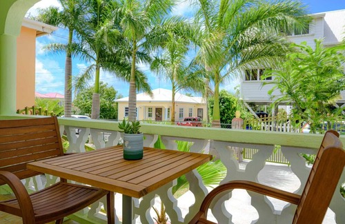 Cades Bay House | Two bedroom, 2 bathroom house in a tropical palm and garden setting.