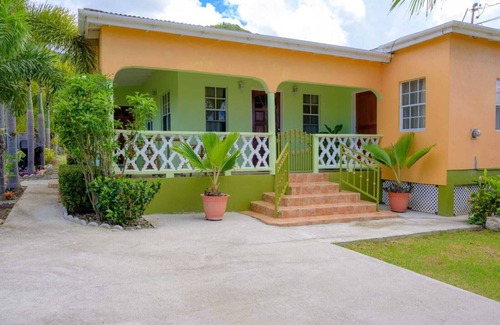 Cades Bay House | Two bedroom, 2 bathroom house in a tropical palm and garden setting.