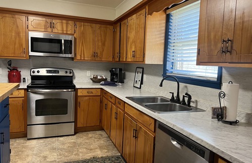 Mount Ida House | Two bedroom House with fenced in yard, covered patio area, located at the Joplin Inn at the entrance to Mountain Harbor, just 1 1/2 miles from Lake Ouachita. by RedAwning