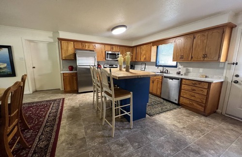 Mount Ida House | Two bedroom House with fenced in yard, covered patio area, located at the Joplin Inn at the entrance to Mountain Harbor, just 1 1/2 miles from Lake Ouachita. by RedAwning