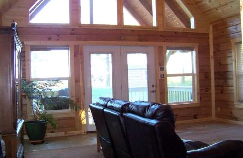 Steelville House | Two-Story Log Cabin Rental with a Hot Tub near Upper Meramec River, Missouri