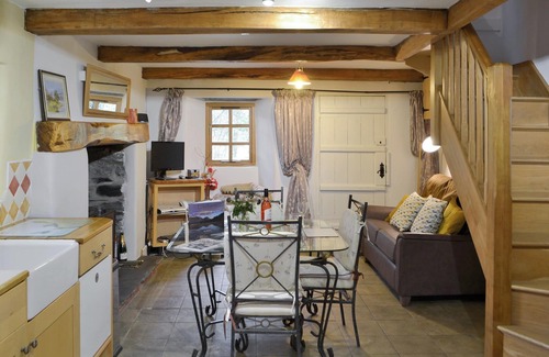 Ulpha Cottage | Unique cottage with a cosy living room set around an Inglenook fireplace.