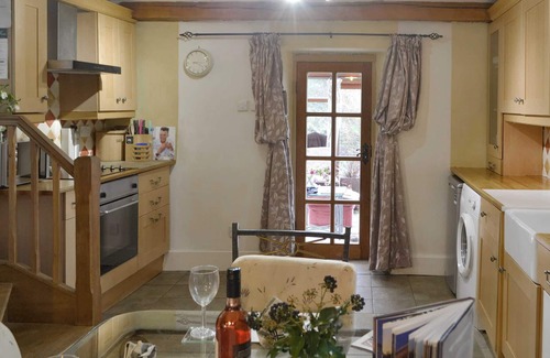 Ulpha Cottage | Unique cottage with a cosy living room set around an Inglenook fireplace.