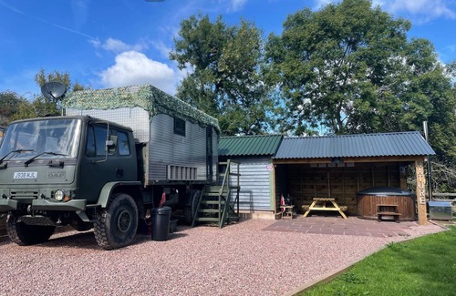 Usk House | Unique stay in your very own army truck. Sleeps 4. Hot tub. Tranquil setting.