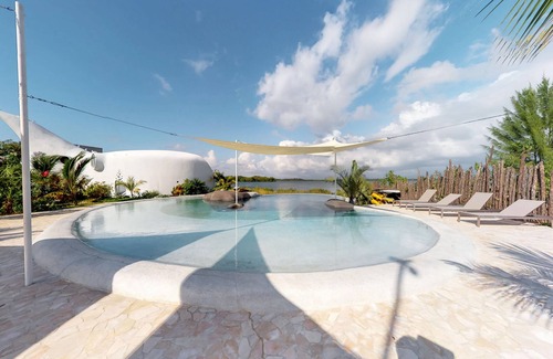 Cocoplum Apartment | Unique waterfront studio with AC, pool, bikes, & kayaks