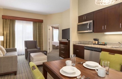 Feather Sound Hotel | Unwind and Indulge In Our Oasis! Outdoor Pool, Free Breakfast, Full Kitchen!