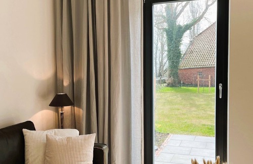 Rysum Apartment | Vacation apartment Bütz - vacation in the historic Gulfhof with modern comfort