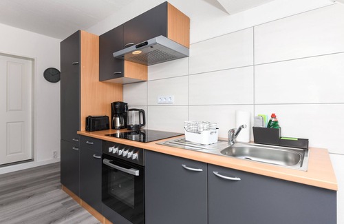 Holtriem Apartment | Vacation apartment Abendrot - House Auszeit Crusoh in Schweindorf