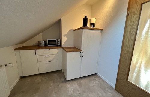 Pilsum Apartment | Vacation apartment "Leuchtturm" with large garden in the heart of Pilsum