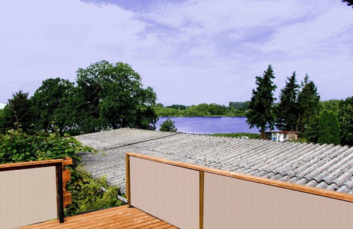 Demen House | Vacation apartment with roof terrace and idyllic view of the village lake