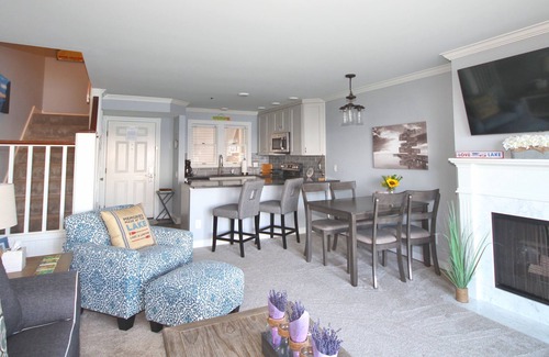 Boyne City Condo | Vaulted Ceilings + Prime Lake Charlevoix Views | Fireplace | Private Patio|