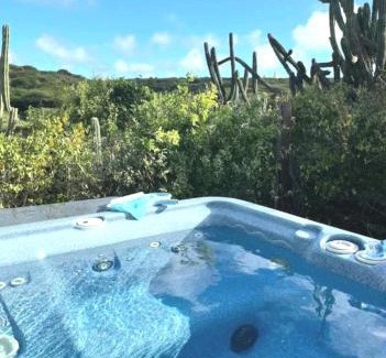 Savaneta Apartment | Very quiet apartment with lots of privacy and a tub on the edge of a national park!