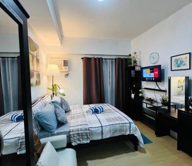 Phil-Am Apartment | Vinia Infinity Studio 2 Near Malls with WiFi Netflix and Karaoke