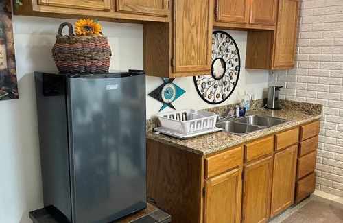 Republic Apartment | Walkout basement apartment with private patio supplied with a grill and fire pit