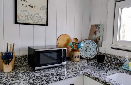 Phippsburg Cottage | Watch the sunshine dancing off the ocean in this quaint ocean front cottage.