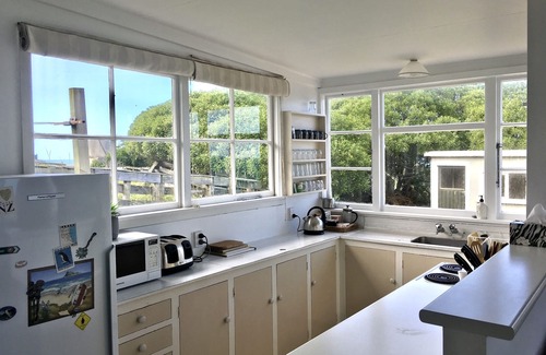 Kakanui House | Watch the weather roll in along the coast with sea views from every room.