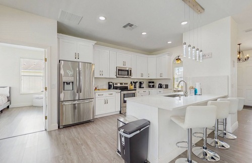Trafalgar Village House | Water view retreat with lanai, heated pool, pool spa, game room, & AC