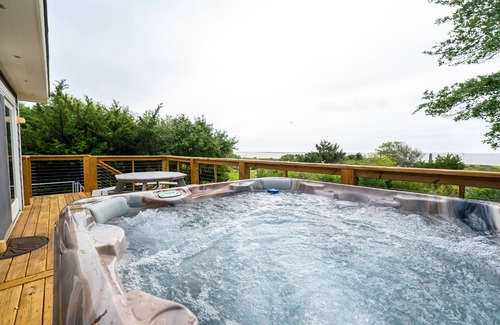 Waves Cottage | Waterfront 2-Bedroom, 1-Bathroom Cottage with a Hot tub and Waterfront Deck