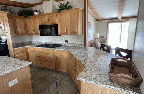 Galloway Cabin | Waterfront Bungalow nightly panoramic view of our illuminated covered Bridge