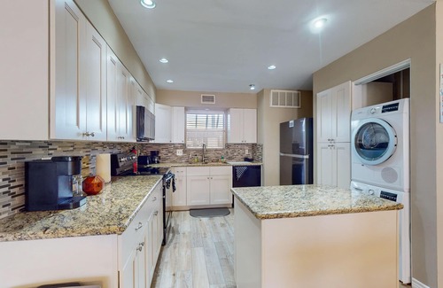 El Lago Condo | Waterfront community condo with on-site pool, water views, & private patio