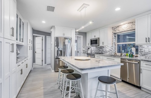 Yacht Club House | Waterfront escape in the heart of the action with pool, spa, grill, & WiFi