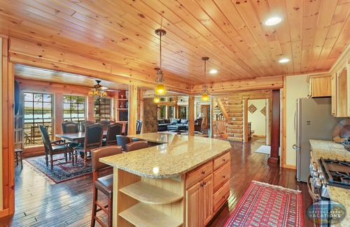 Whitewater House | Waterfront, Hand-Crafted Log Cabin |Sandy Beach |Dock |5200 Sq Ft |3.5 Acres |Stone Fireplace |Views