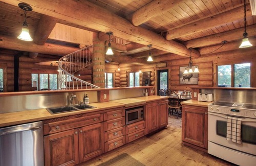 La Minerve Cottage | Waterfront Log Cottage with Hot Tub and Sauna