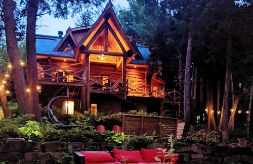 La Minerve Cottage | Waterfront Log Cottage with Hot Tub and Sauna