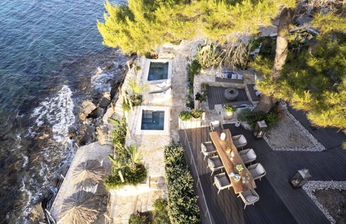Amoudi Villa | Waterfront Villa Alexandros with Outdoor Jetted Tub